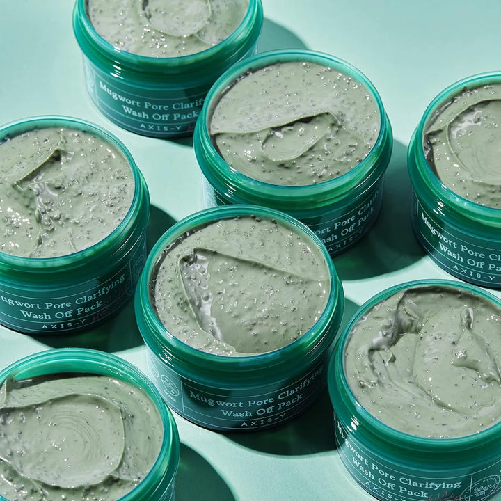 Close-up texture of green clay mask showing beans / granules