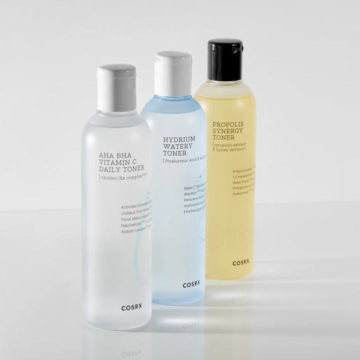 “Flat-lay of COSRX Propolis Synergy Toner with honey and propolis ingredients displayed”