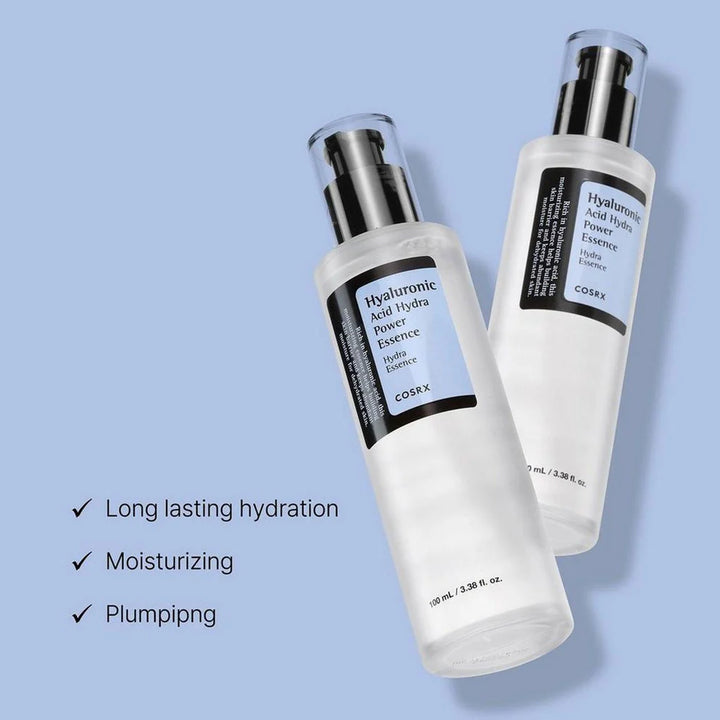 “Flat-lay: COSRX Hyaluronic Essence beside clean skincare tools on pastel surface”