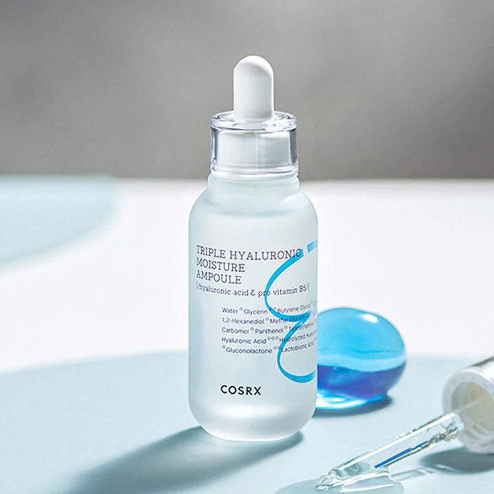 “Close-up of ampoule drop on hand showing thick hydration texture”