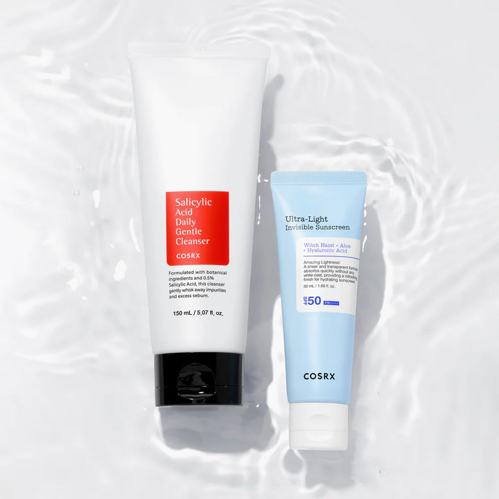 COSRX Salicylic Acid Cleanser with COSRX Ultra-Light Invisible Sunscreen flatlay on water surface