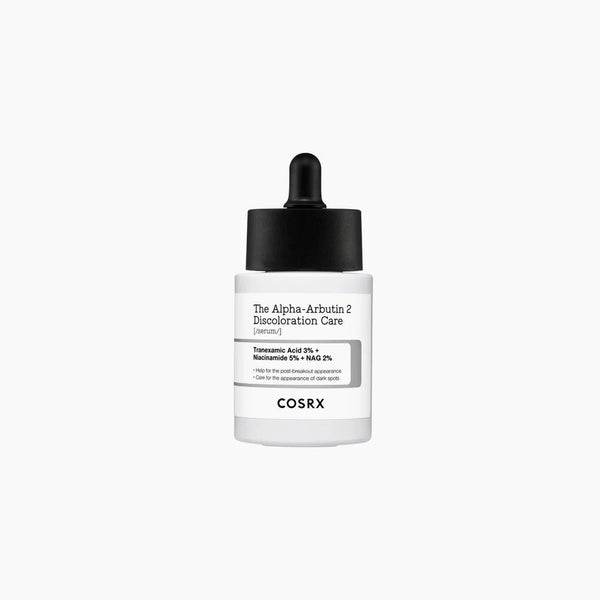 COSRX The Alpha-Arbutin 2 Discoloration Care Serum bottle with black dropper cap, labeled with Tranexamic Acid 3%, Niacinamide 5%, and NAG 2%.