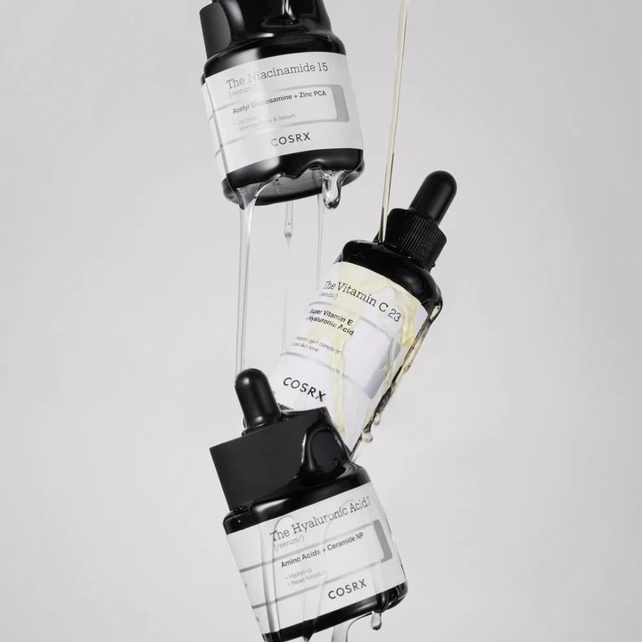 “Model applying COSRX Niacinamide 15 Serum on face focusing on oily / acne-prone areas”