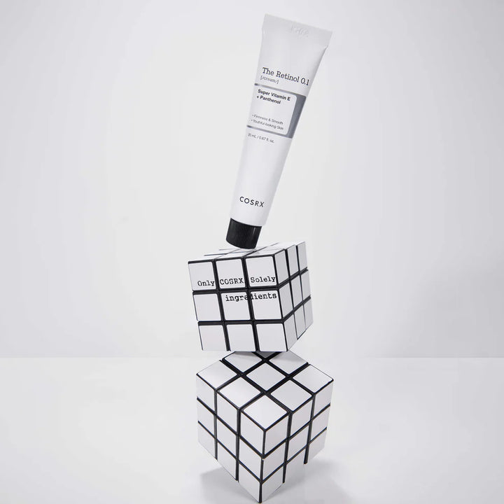 “Model applying COSRX Retinol 0.1 Cream to jawline for anti-aging care”